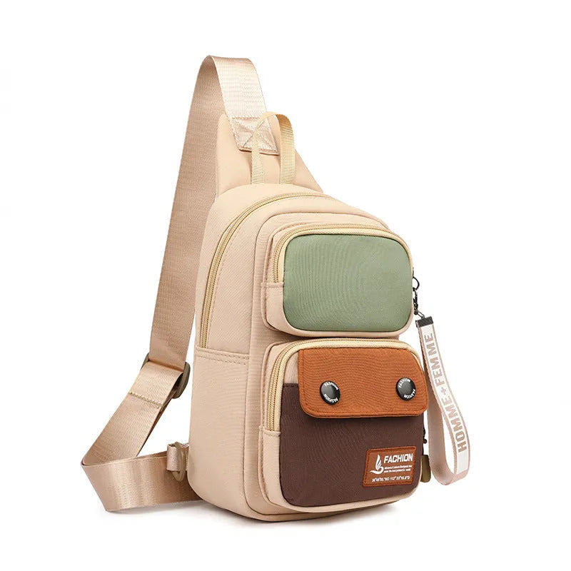 Crossbody shoulder bag in nylon with polyester lining, showing storage compartments
