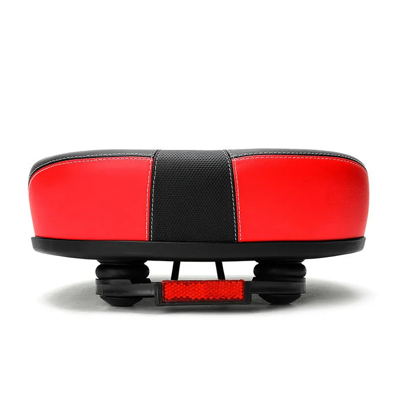 Large red bicycle saddle with thickened padding and reflective elements for ordinary bicycles