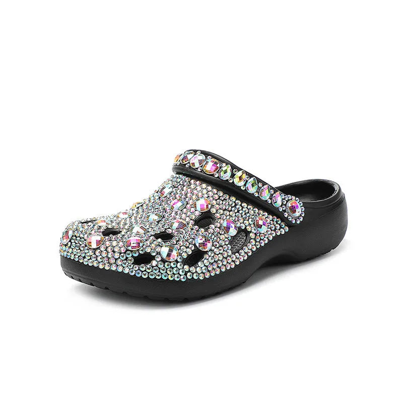 Black women's platform sandals with rhinestone details on an EVA upper and sole.