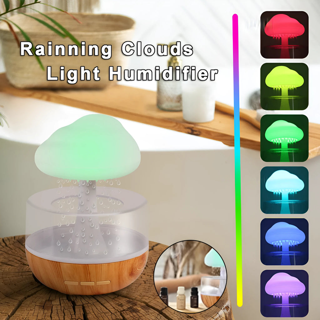 White cloud-shaped humidifier with night lights and water droplet effect on desktop