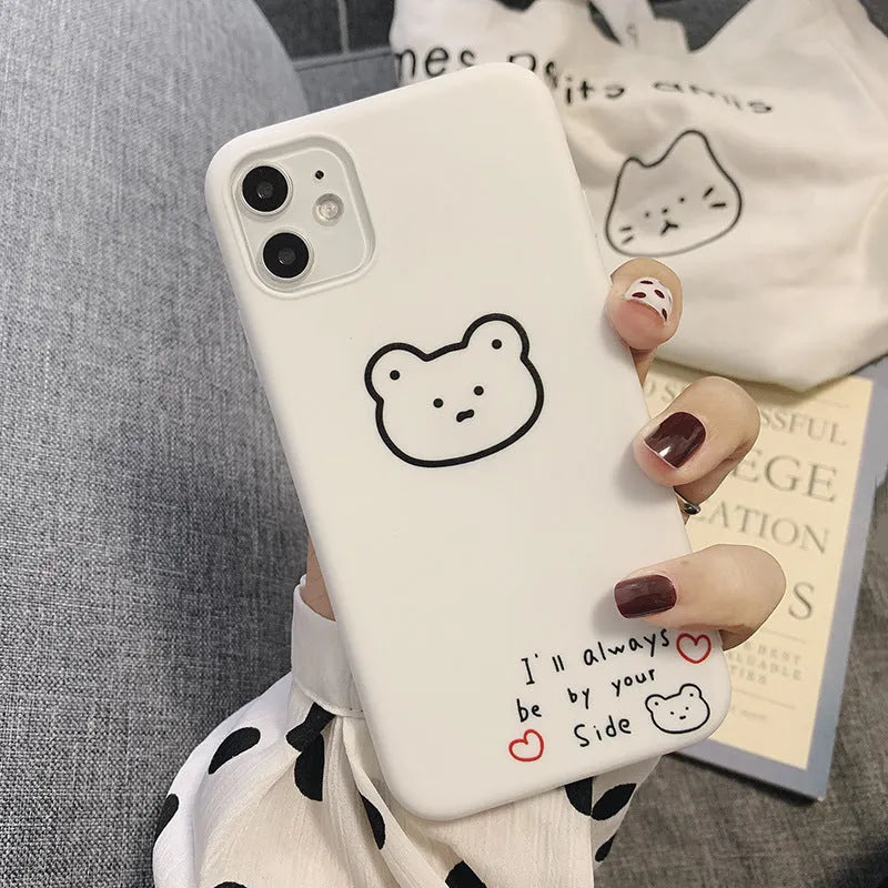 Soft silicone iPhone case featuring a cartoon Korean bear design on a white background.