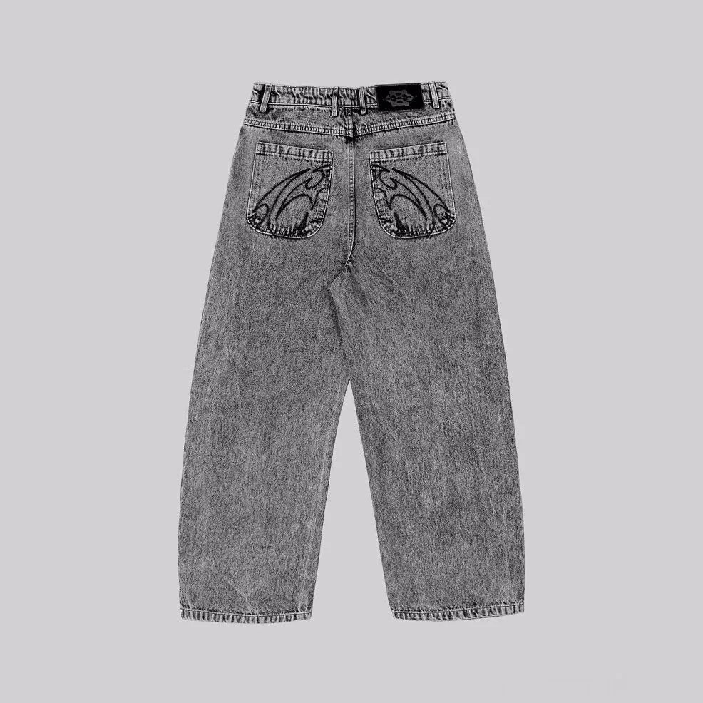 Grey loose straight-leg cotton denim trousers on a hanger