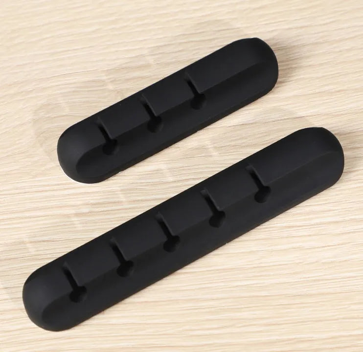 Black silicone desktop cable manager clips with strong double-sided glue for USB cables and wired headphones