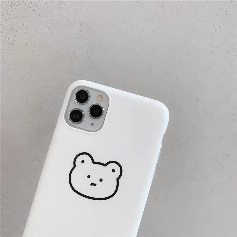 Soft silicone iPhone case featuring a cartoon Korean bear design on a white background.