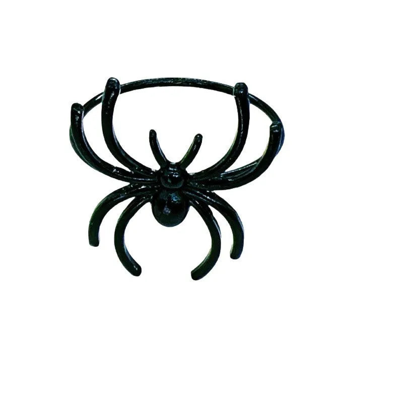 Set of six black spider patterned alloy napkin rings for Halloween table decoration