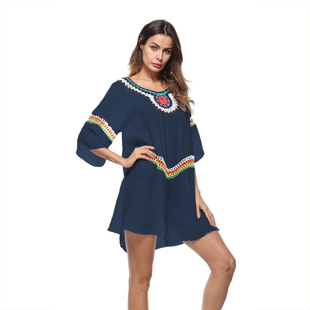 Crocheted ethnic style women's beach cover-up in acrylic fabric for sun protection.