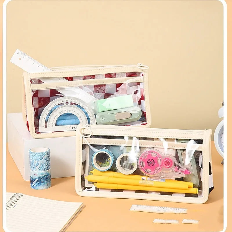 PVC transparent pencil case with chessboard pattern showing pens inside, dimensions 21.5 x 8 x 11.5 cm