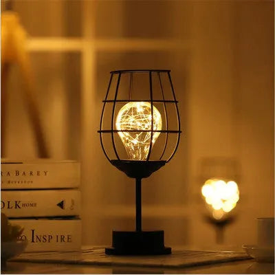 Iron hollow table lamp in bottle style with warm white LED illumination