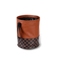 A leather interior car trash can shown in a folded and unfolded state.