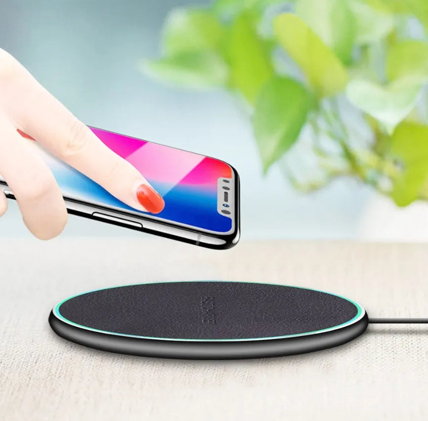 Black Qi wireless charging pad for iPhone 11 with non-slip surface and LED indicator