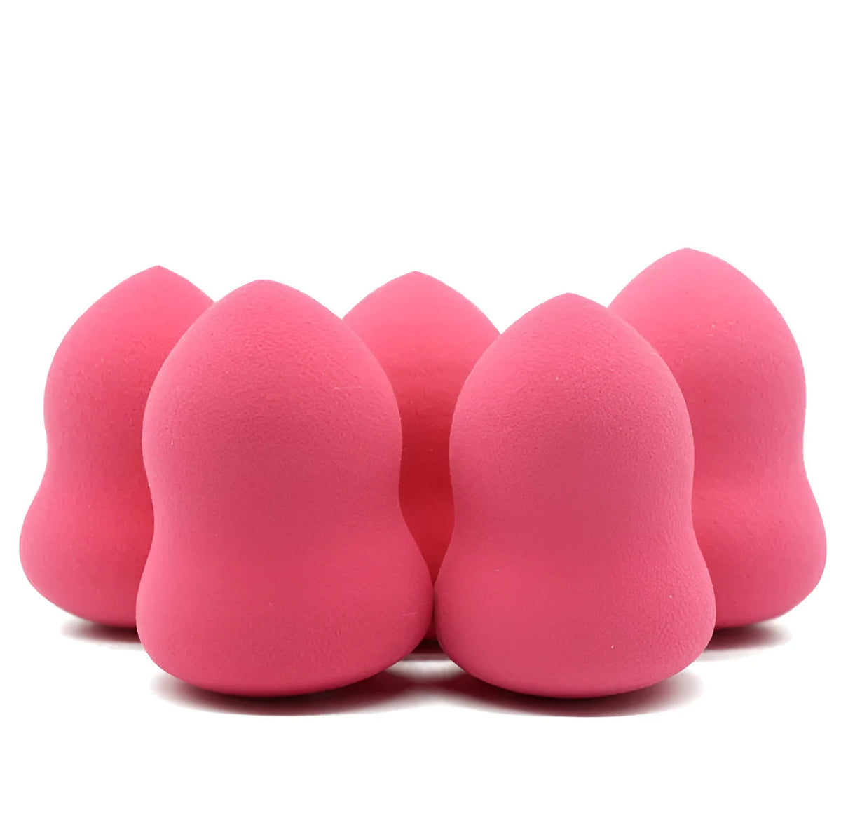 Pink makeup foundation sponge with chiselled edges for blending, shown next to a ruler showing 4cm width.
