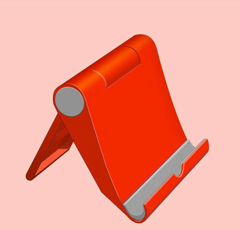 Black folding mobile phone stand holding a smartphone at an angle on a wooden table