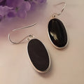 Women's black agate oval pendant earrings with geometric Chinese style framework and 925 silver electroplated finish