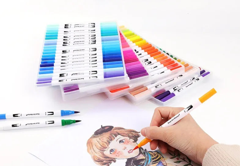 Watercolour pen set showing multiple colours creating ink wash effects on paper