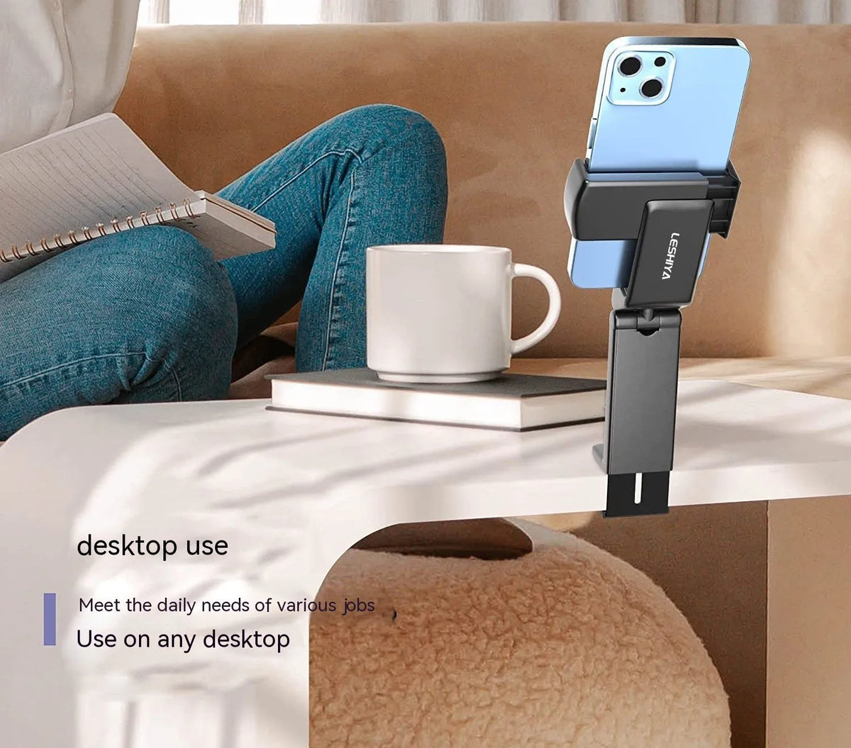 Black foldable rotating phone holder showing adjustable angles on a desk