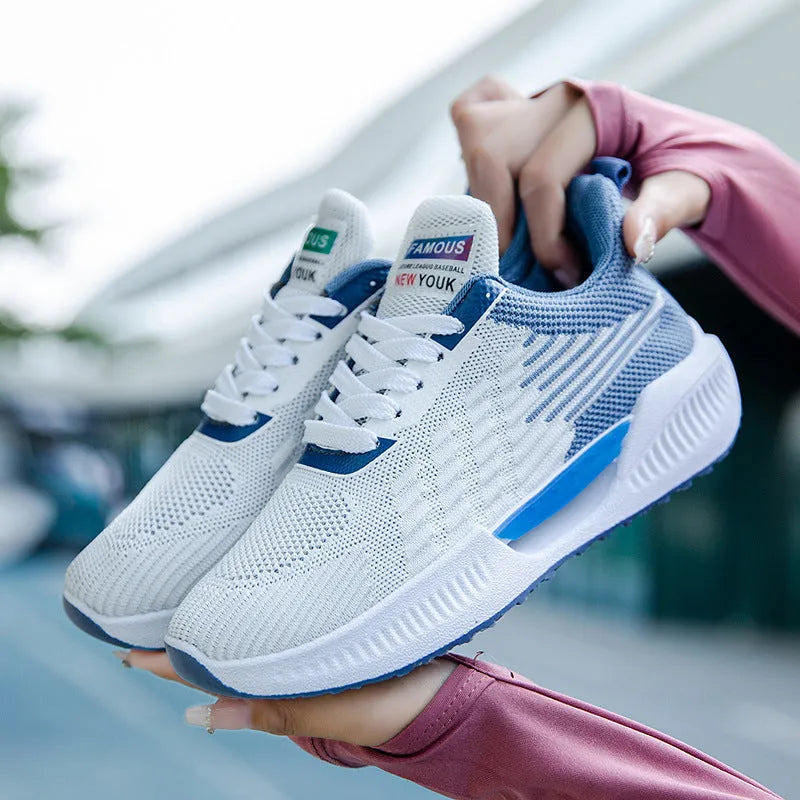 Men's blue mesh casual shoe with round toe and cloth upper, displayed on a white background.