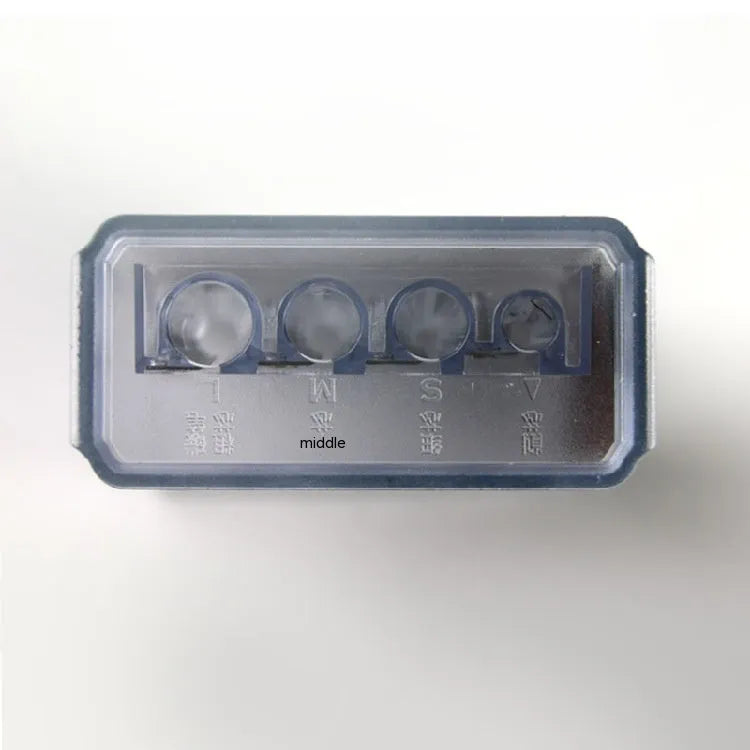 A geometric plastic pencil sharpener with four holes, shown with its integrated screwdriver tool.