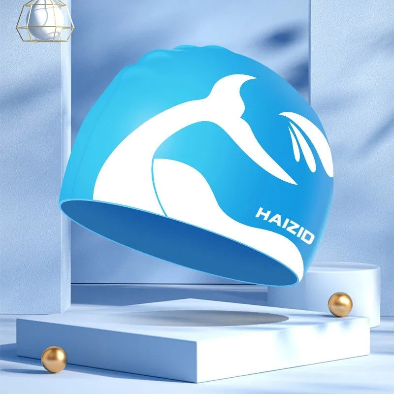Silicone swim cap with whale tail pattern and waterproof ear protectors in multiple colours