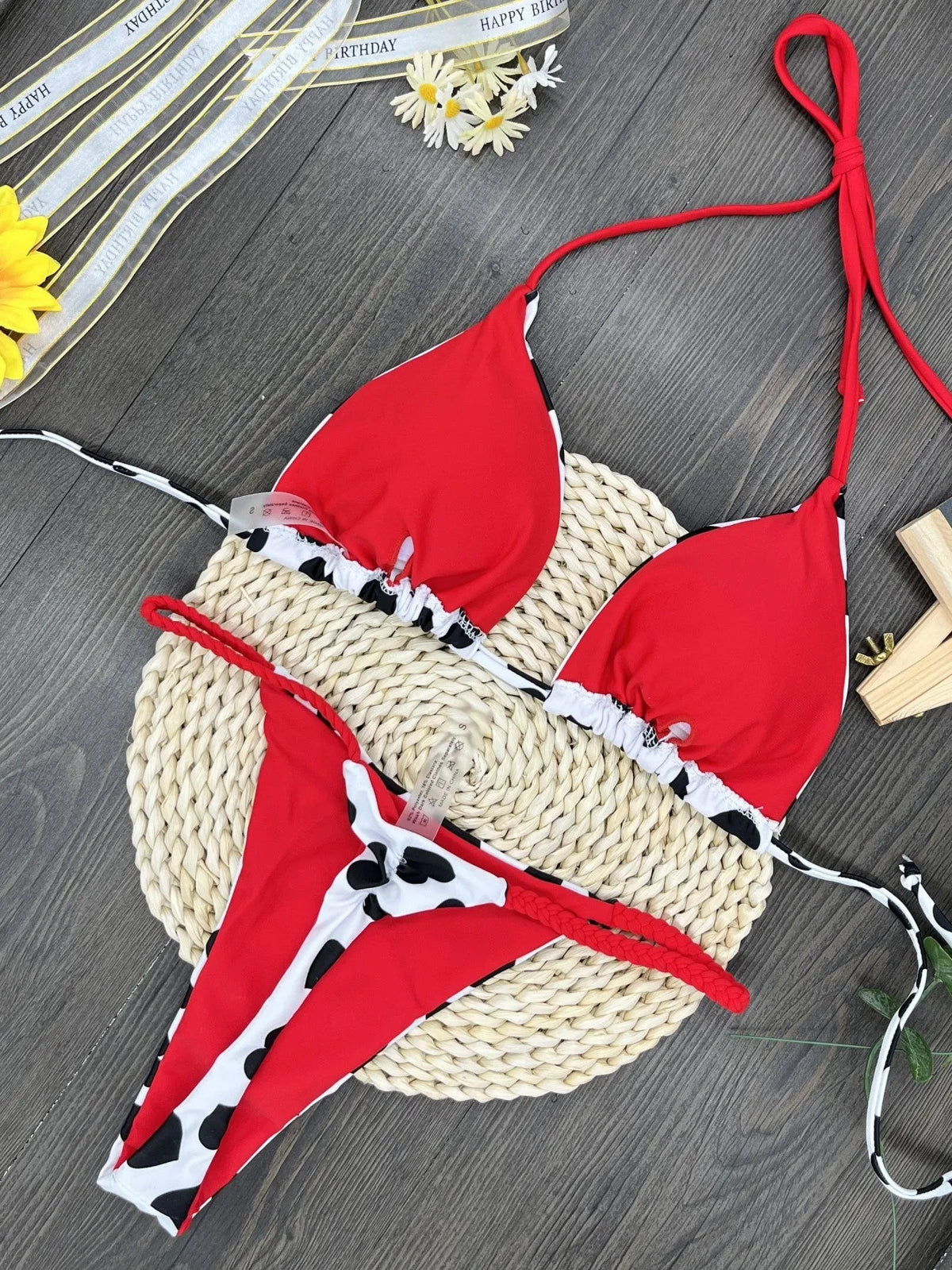 Sexy solid-colour swimsuit with heart print, backless design, and split detail.