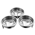 Stainless steel heart-shaped egg steamer for boiling eggs on kitchen counter.