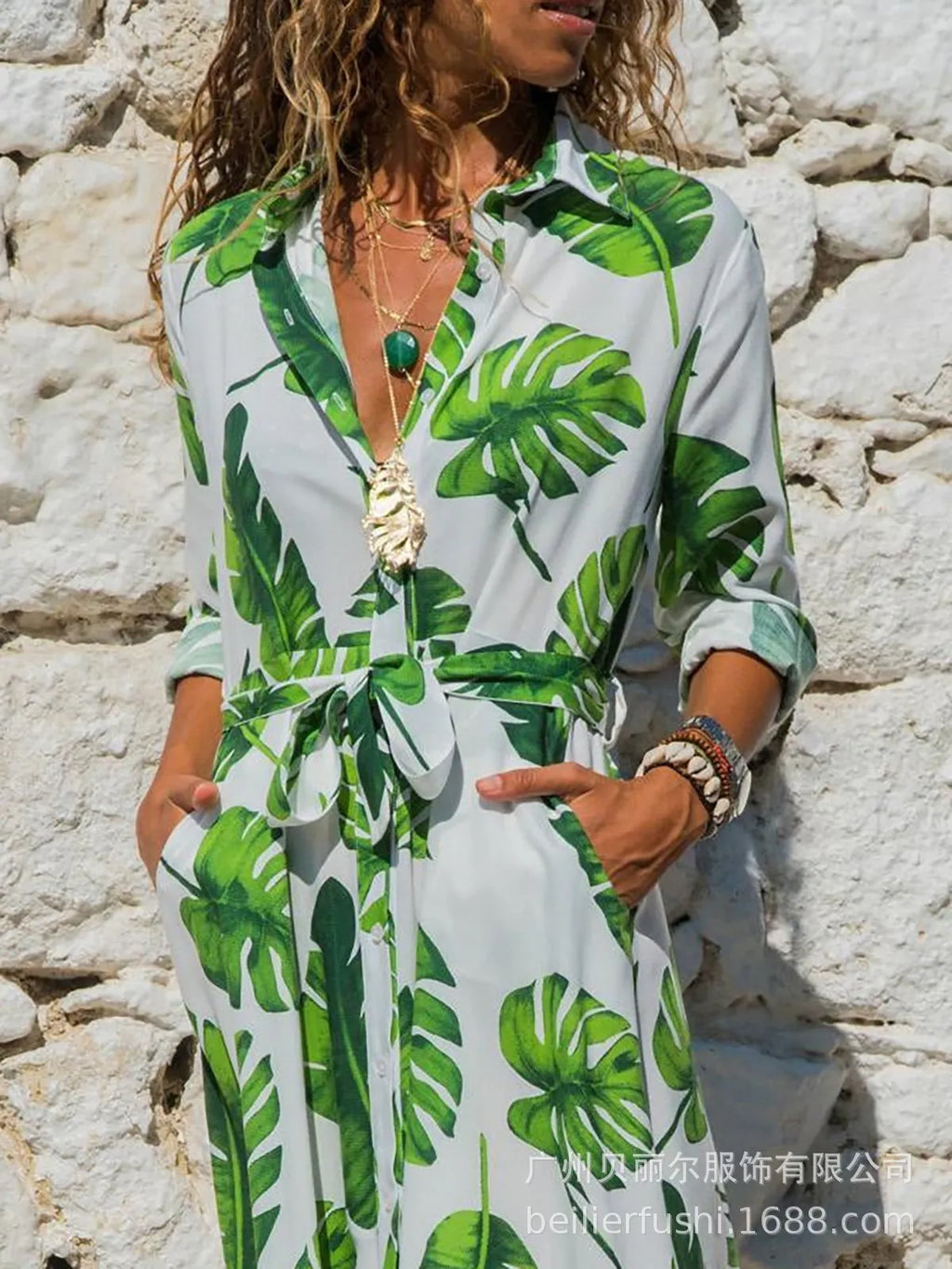 Women's black printed chiffon V-neck dress with an A-line skirt and conventional sleeves.