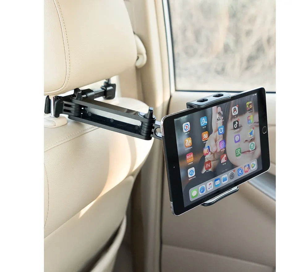 Black universal car phone holder mounted on car rear seat base with tablet in cradle