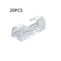 Transparent plastic self-adhesive cable routing snap clips in small, medium, large, and extra large sizes.