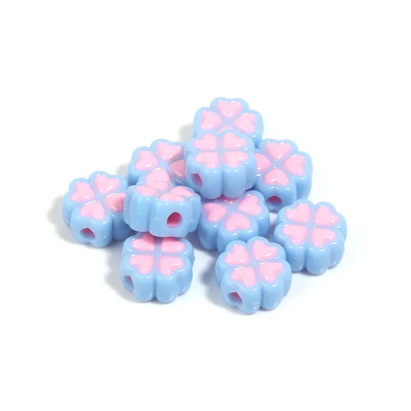 15mm acrylic clover-shaped beads with love pattern in multiple pastel colours including rose red, pink, yellow, green, blue, and purple