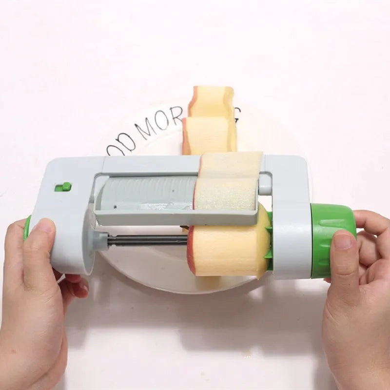 Green and white ABS and PP plastic kitchen multifunctional fruit slicer, 22.5cm by 10.5cm by 5.5cm