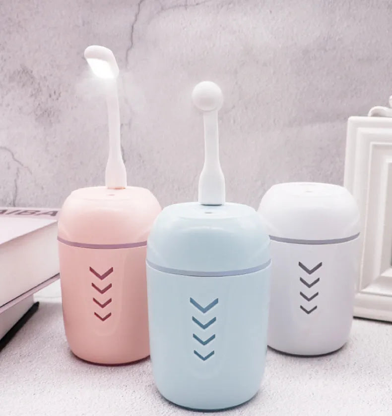Portable car humidifier with columnar design in blue, pink, and white colour options