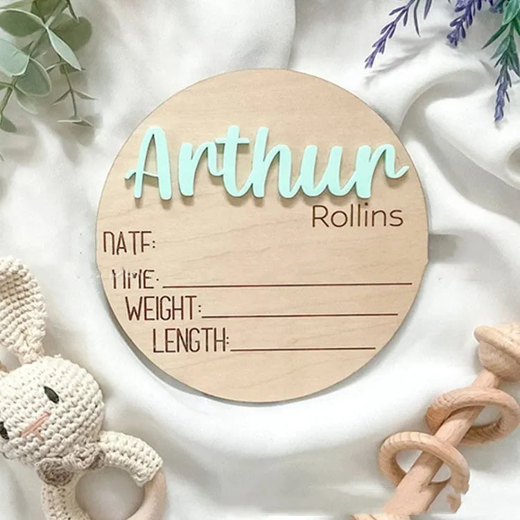 Brown limewood baby birth announcement board in a modern art style, available in sizes from 102mm to 203mm.