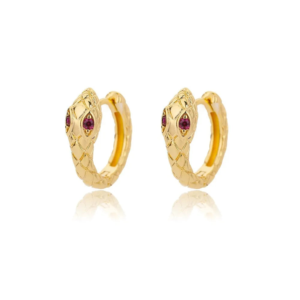 A pair of women's geometric butterfly-shaped earrings made from copper with heart and star details.