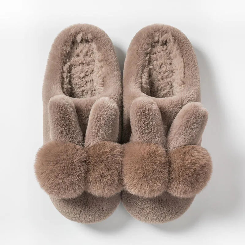 Women's high-top rabbit fur slippers in creamy white with floral detail and a sewn sole.