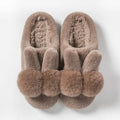 Women's high-top rabbit fur slippers in creamy white with floral detail and a sewn sole.