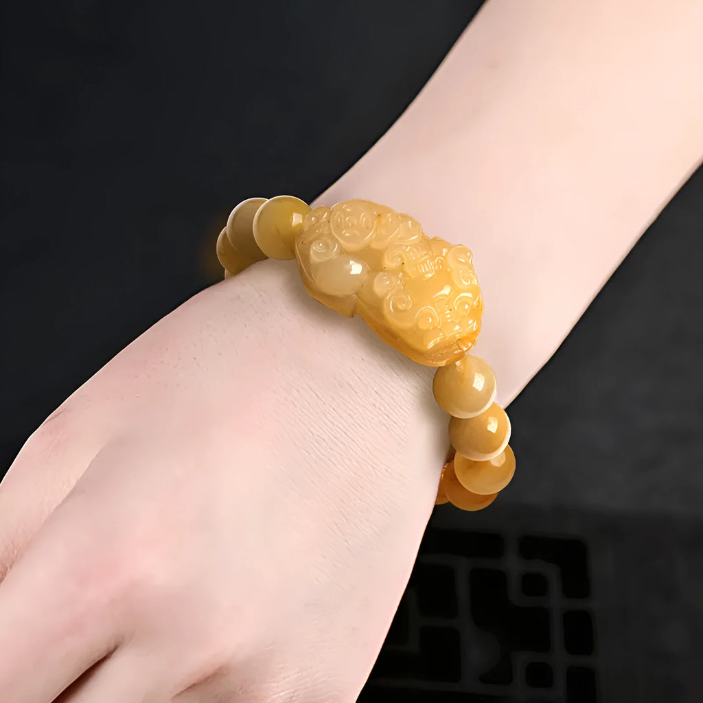 Hand-carved Golden Thread Jade Money Bracelet shown in large and small size options.