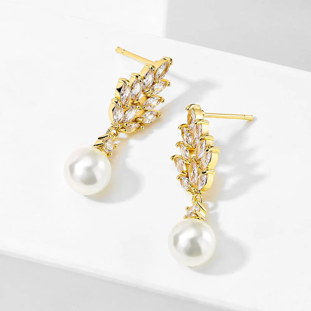 Pearl earrings with micro zircon accents in geometric flower design available in three metal plating options