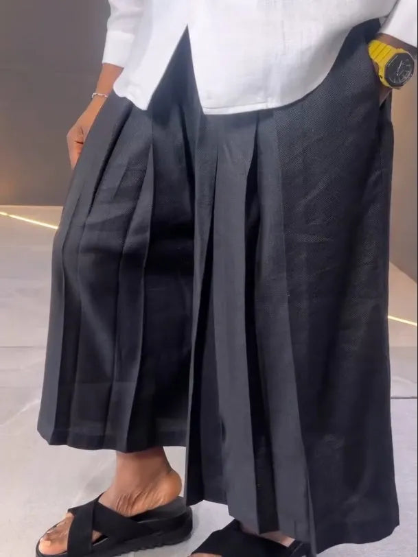 White asymmetric-front long-sleeve shirt and black pleated trousers women's casual set