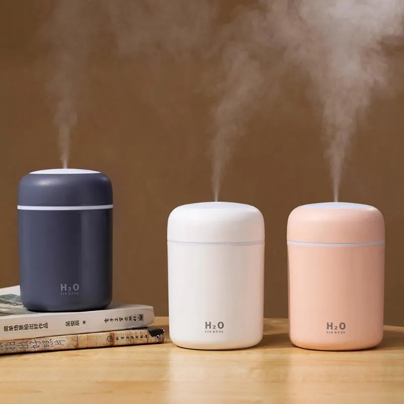Pink USB desktop humidifier with 300ml water tank and colourful atmosphere lighting