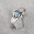 Geometric ellipse women's ring with zircon centre stone in white gold colour