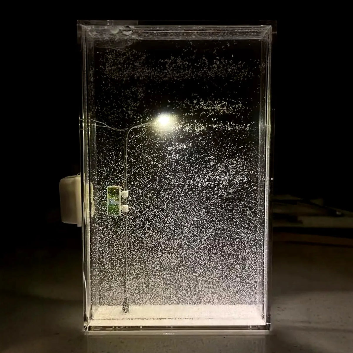 DIY snowy night light kit components for assembling a winter scene desktop decor with LED lights.