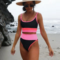 Women's solid colour quick-dry swimwear set showing bikini top and matching shorts