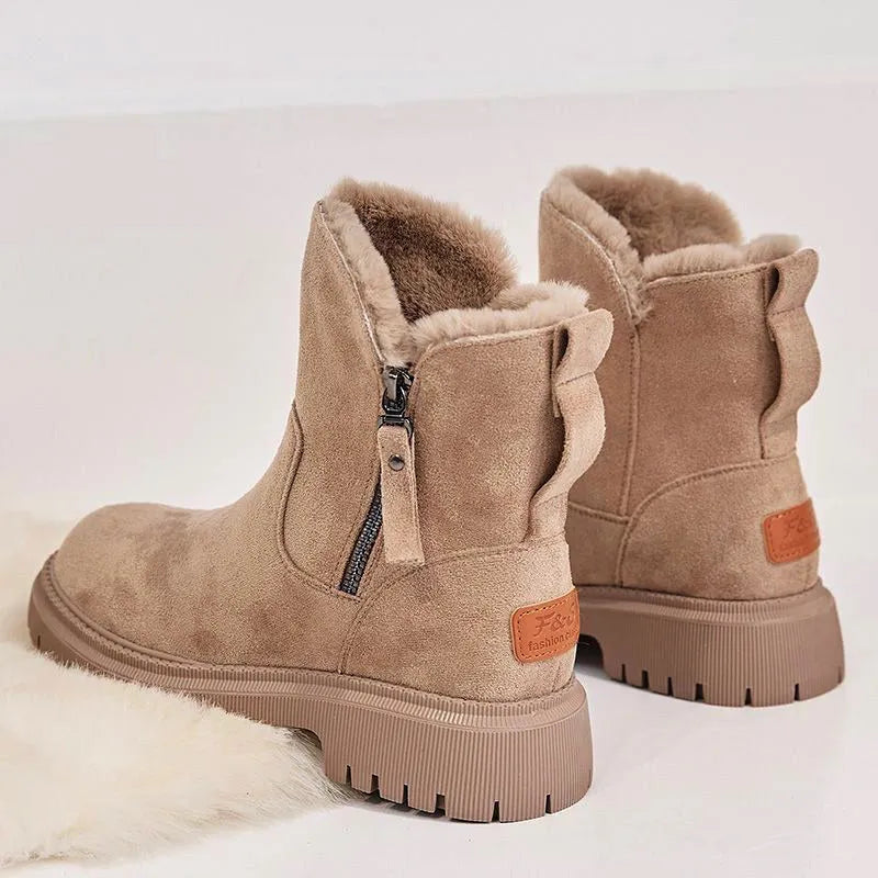 Women's black faux suede high-top snow boots with side zip and non-slip rubber sole.