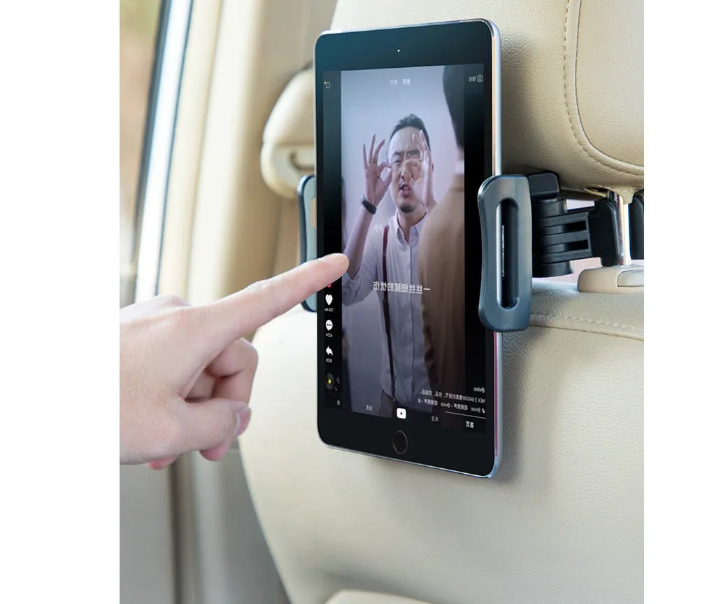 Black universal car phone holder mounted on car rear seat base with tablet in cradle