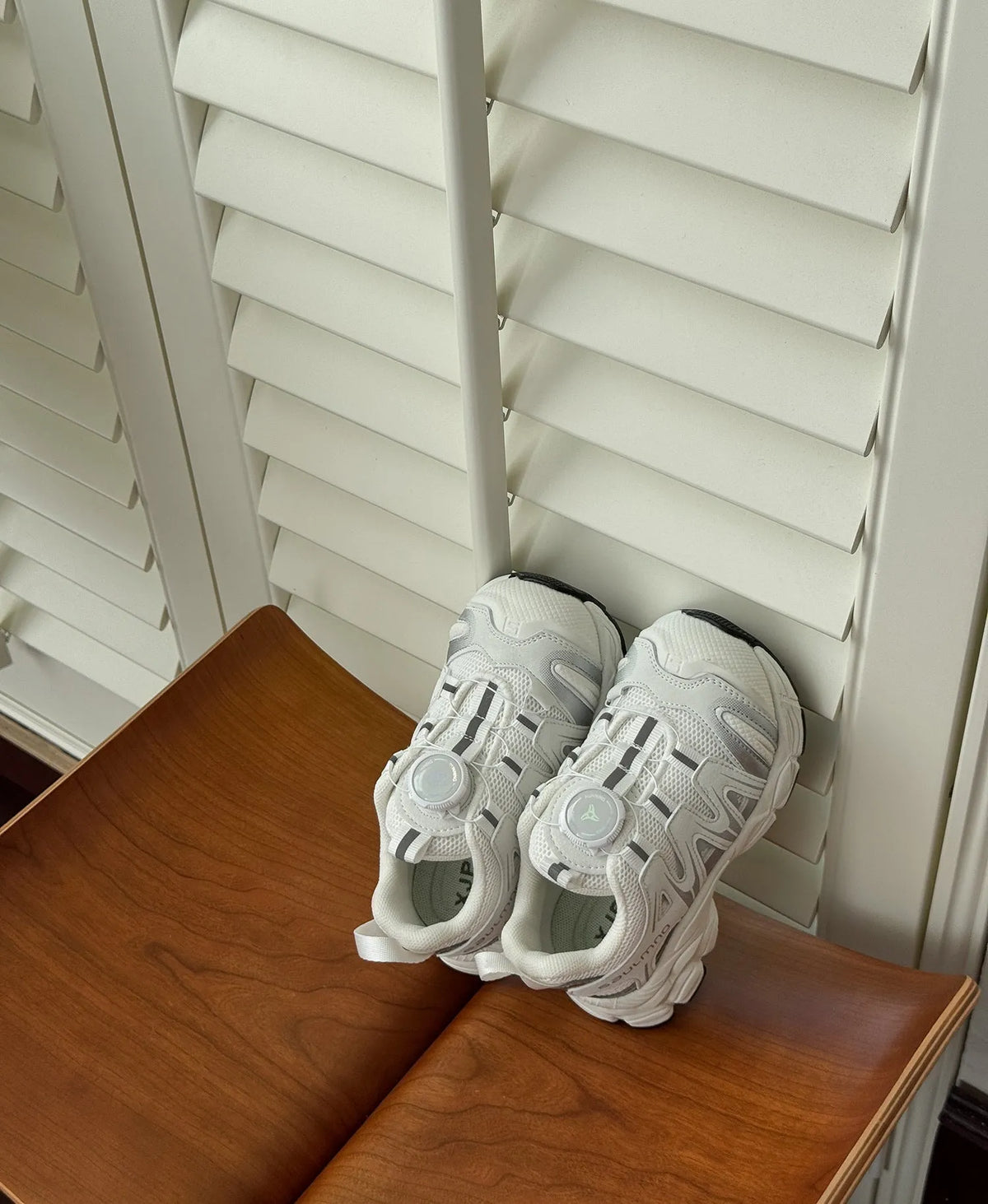 Pair of lightweight casual shoes with a solid-colour breathable mesh upper, shown in beige.