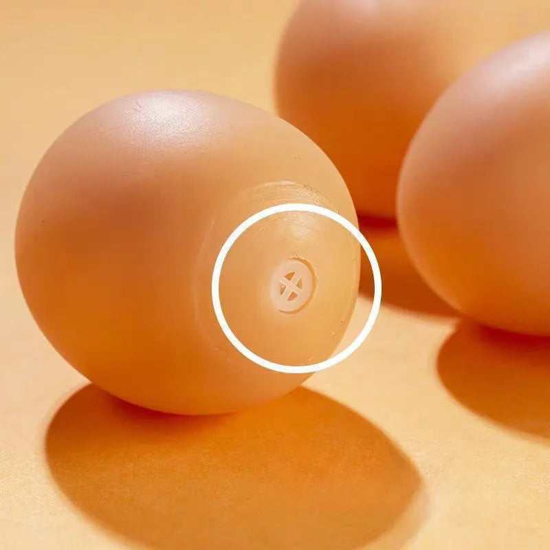 Yellow egg-shaped dog teeth cleaning toy with textured rubber surface for dental care