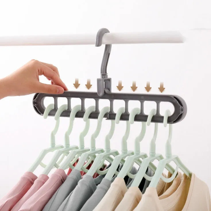 Plastic clothes hanger with rotating hook in pink or green colour for heavy garment storage