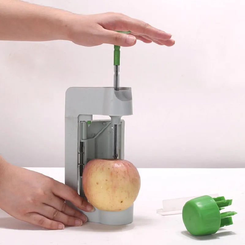Green and white ABS and PP plastic kitchen multifunctional fruit slicer, 22.5cm by 10.5cm by 5.5cm