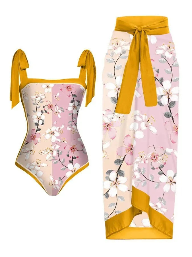 Women's printed floral chiffon two-piece swimsuit with a matching hip skirt.
