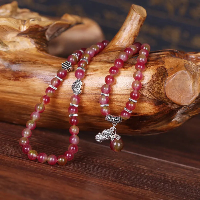 Natural watermelon crystal bracelet with Chinese knot closure and geometric beads