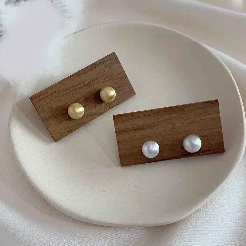 Matte brushed bean-shaped stud earrings in Gold and White for women, compact versatile metal earrings